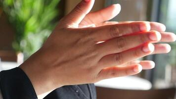 Hand clapping expressing emotions in a cozy indoor setting video