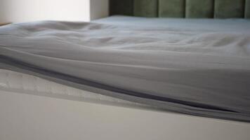 Making a bed with fresh linen and a smooth mattress cover video