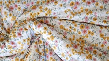 Flower patterned bedding creating a cozy atmosphere in the bedroom video