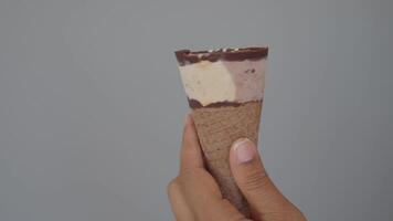 Delicious chocolate topped ice cream cone enjoyed in warm weather video