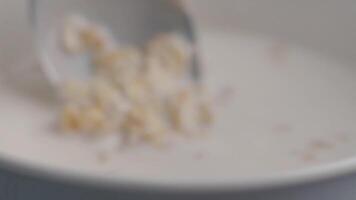 Making a simple breakfast with cereal and milk in the morning video
