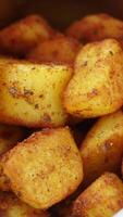 Deliciously crispy roasted potatoes prepared with spices video