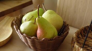 Fresh fruits in a woven basket on a kitchen counter video