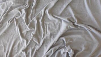 Soft gray fabric elegantly draped on a surface in subtle folds video