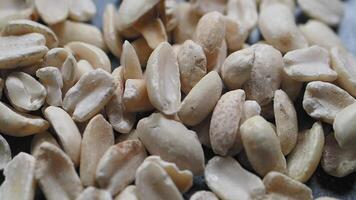 Peanuts being prepared for roasting in an open kitchen video