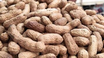 Discovering fresh peanuts at a local market in sunny afternoon video