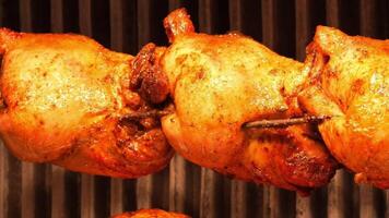 Juicy chicken roasting on skewers at local street festival video