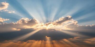 Sunbeams shining through clouds in the sky photo