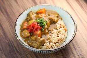 Wagyu Beef Curry rice served in bowl isolated on table closeup side view of Japanese food photo