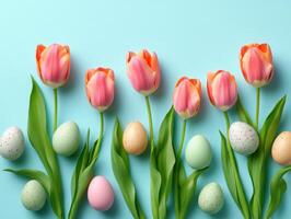A soft, pastel-colored arrangement of tulips and Easter eggs set against a light blue background, perfect for Easter-themed marketing, greeting cards, or springtime social media posts. photo