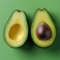 An avocado cut in half, showcasing its creamy green flesh and pit, set against a vibrant green background. Ideal for use in health and wellness content, food recipes, or sustainable living campaigns. photo