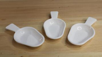 5 ml white plastic medical spoon photo