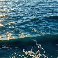 The ocean is blue and has waves photo