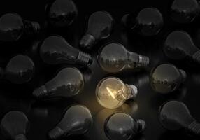 Light bulb on and off on a black background, creative ideas concept13 photo