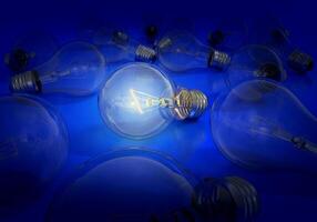 Light bulb on and off on a blue background, creative ideas concept photo