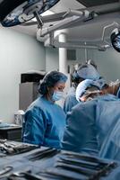 Doctors working using the latest medical technologies in cardiology and transplantation. Surgeons are working to save the patient in the hospital. Medicine, health and science. photo