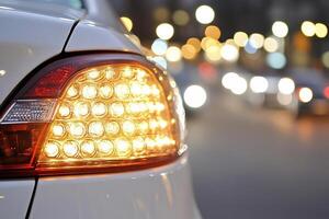 A close up of a car with its lights on photo