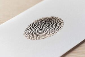 A fingerprint is shown on a piece of paper photo
