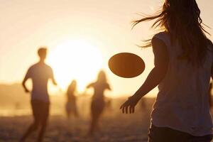 A woman is throwing a frisbee on the beach photo