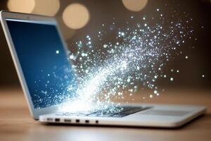 A laptop computer with sparkles coming out of it photo
