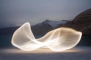 Light painting on a beach with mountains in the background photo