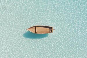 An aerial view of a boat floating in the ocean photo