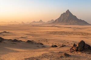 The desert is covered with rocks and sand photo