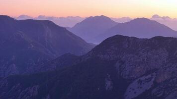 Aerial sunset view of mountain ranges with mist video