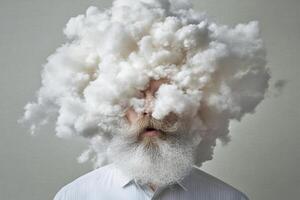 A man with a beard and clouded head photo