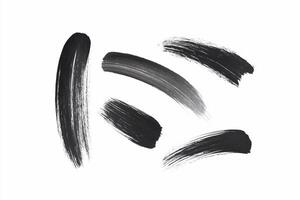 A black brush stroke is shown on a white background photo
