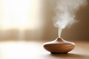 A small wooden aroma diffuser is on a table photo