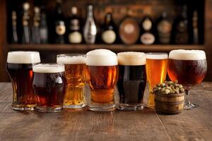 A row of beer glasses with different types of beer photo