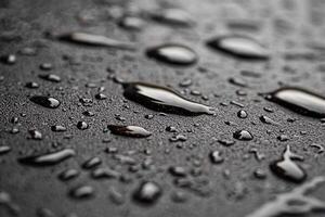 Water droplets on a black surface photo