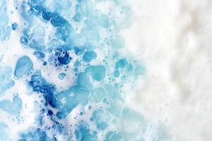 A blue and white foam with bubbles on it photo