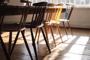 A row of chairs in front of a table photo