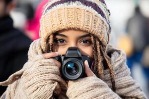 A young woman is taking a photo with a camera