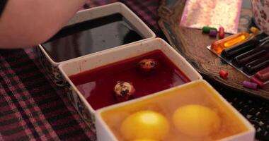 Engage in the joyful process of egg painting as vibrant colors transform simple eggs into beautiful Easter eggs. Discover various techniques used in this fun filled activity. video