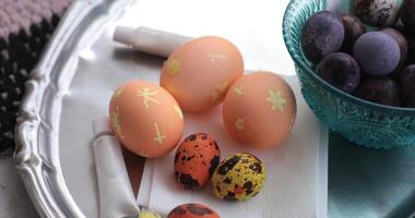 Explore the exciting step of egg painting process, uncovering hidden Easter eggs. Join in this joyful activity, perfect for spring celebrations with family and friends. video