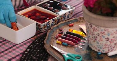 Discover the step of egg painting process as different techniques are used to create colorful Easter eggs. Watch as tools and colors blend for festive decoration. video