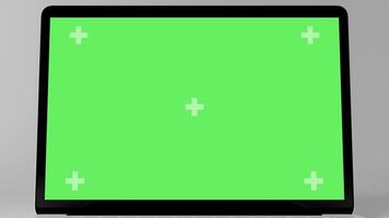 Green Screen Display Laptop Opens and Zoom In on a White Background. Empty Green Mock-up Monitor for Call, Website Template Presentation or Game Applications. Blank Screen Monitor 3D render video