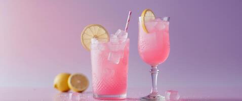 Refreshing Pink Lemonade with Lemon Slice and Ice Cubes in a Decorative Glass - The Ultimate Summertime Drink on a Soft Pink and Purple Background photo