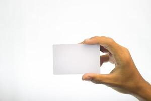A hand holding a blank white isolated a white background. photo