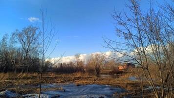 A Serene and Beautiful Winter Landscape Featuring a Clear Blue Sky and Frosted Trees. Early spring or late autumn. photo