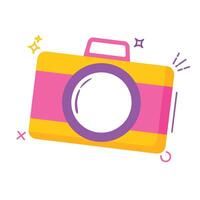 The image shows a cartoon illustration of a camera. The camera body is rectangular and features alternating horizontal bands of yellow and pink. vector