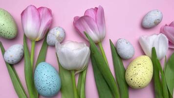 Colorful easter eggs and tulips create a festive spring arrangement video