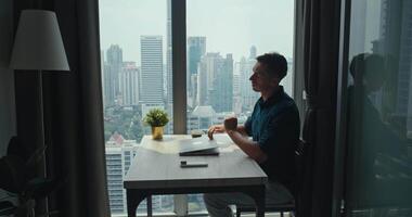 Freelancer finished work compiling data for urgent report, freelancer thriving in elevated workspace, freelancer demonstrating resourceful approach, captivating for modern independent work visuals. video