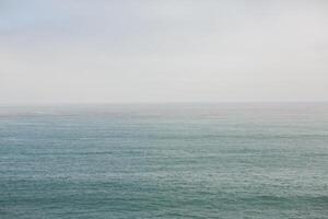 the horizont line over pacific ocean photo