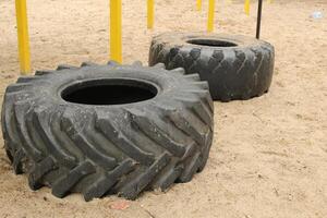 Car tires are lying on the ground. Resource reuse photo