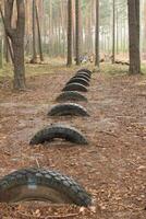 Car tires are lying on the ground. Resource reuse. photo