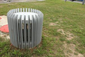 The ventilation shaft sticks out of the ground and is covered with a decorative box photo